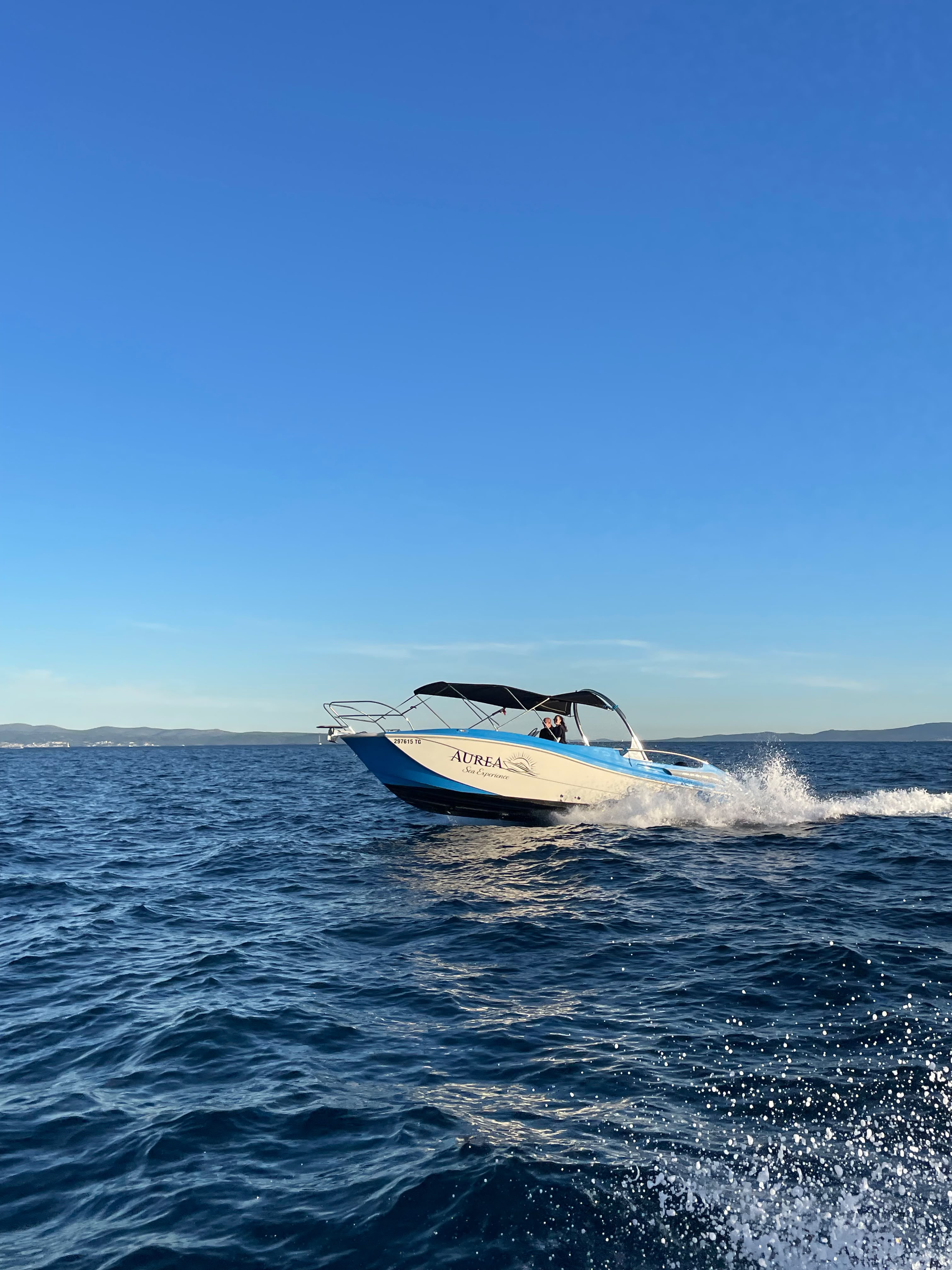 Speedboat cruising toward the islands